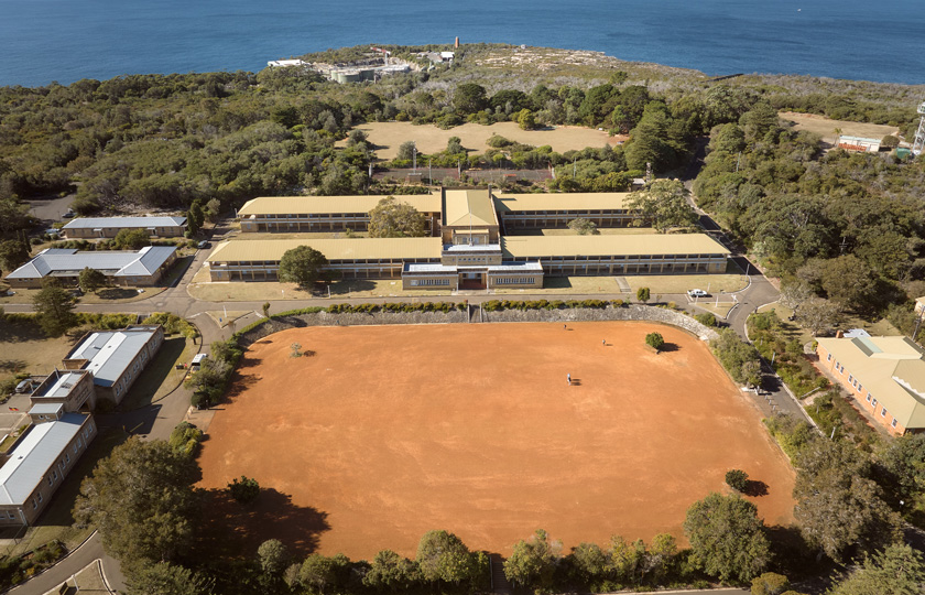 Aerial image of the red gravel Parade Ground at North Head Sanctuary.