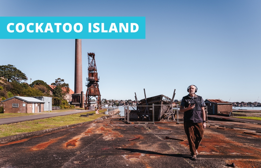 Guest exploring Cockatoo Island's lower island while listening to an audio tour.