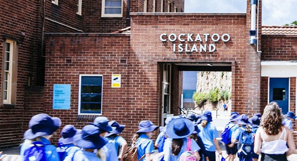 A primary school group entering Cockatoo Island with their teacher to start their Cockatoo Island education program. A primary school group entering Cockatoo Island with their teacher to start their Cockatoo Island education program.